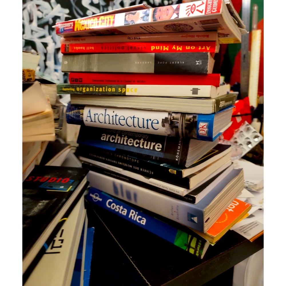 Stack of Architecture and travel books compact size boots